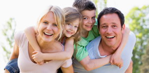 Smiling family of four